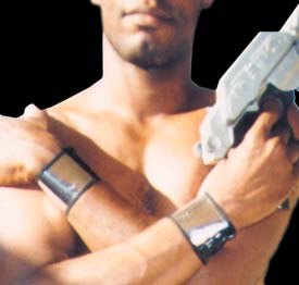 A crop shot of me wearing two shiny chrome wristbands